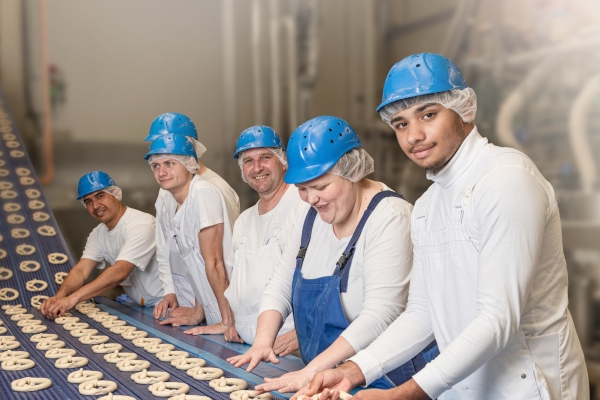 Ditsch production employee in protective clothing.