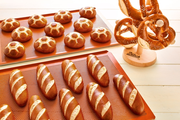 Selection of fresh Ditsch lye pastries - golden-brown, sprinkled with salt crystals.