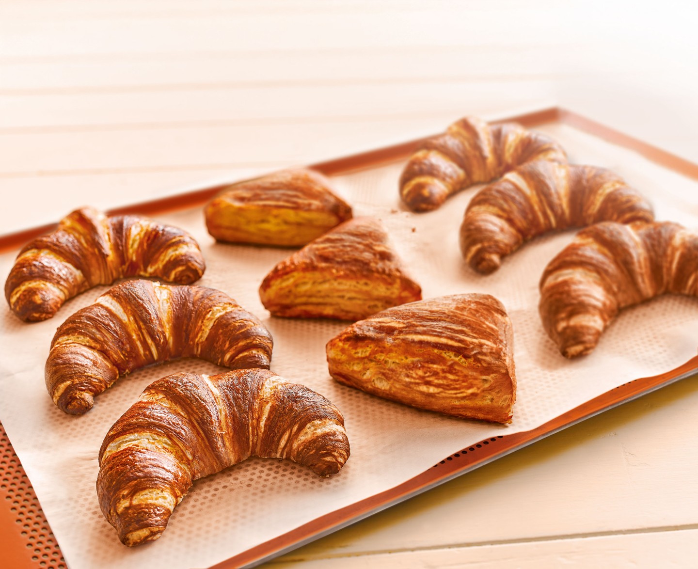 Tiered stand with lye croissants and sandwich variant.